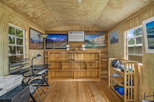 sunroom with plenty of natural light and a wall mounted air conditioner