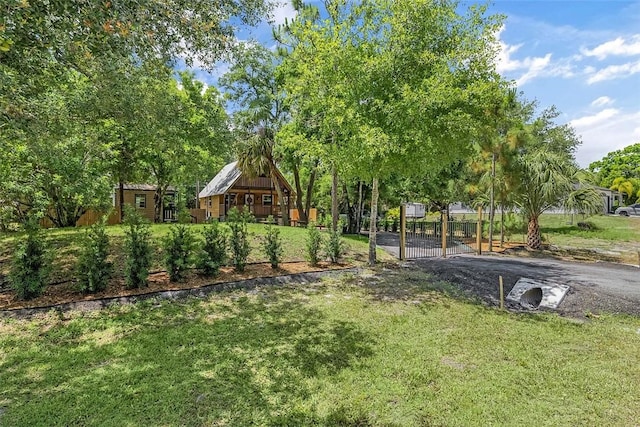 view of yard featuring fence and a gate