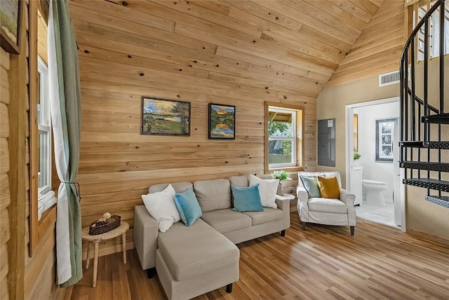 living area with wood ceiling, visible vents, wood finished floors, stairway, and lofted ceiling