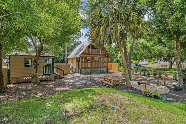 exterior space with a porch and metal roof