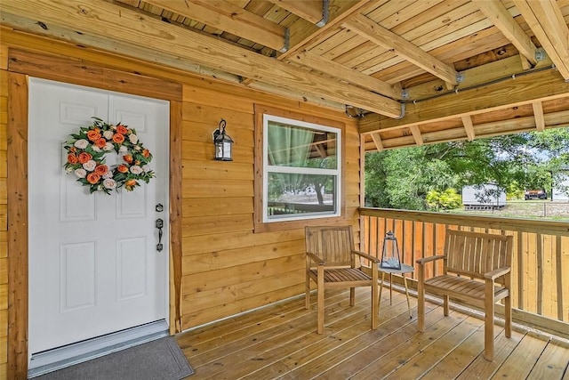 property entrance featuring a deck