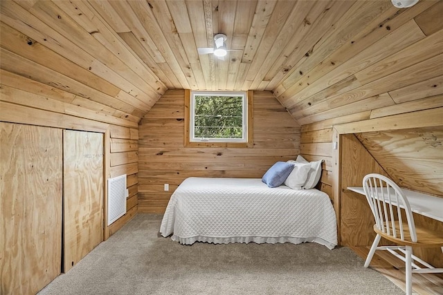 bedroom featuring wooden walls, wood ceiling, lofted ceiling, and visible vents