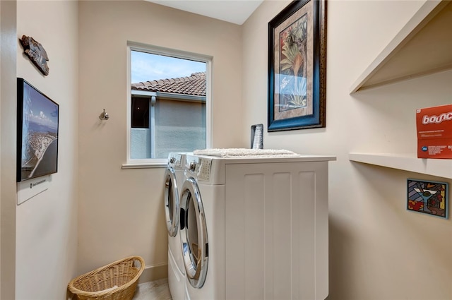 laundry area with independent washer and dryer