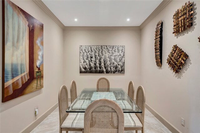 dining space with ornamental molding