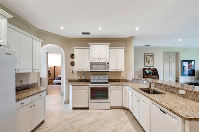 kitchen featuring white cabinetry, sink, light stone counters, crown molding, and white appliances