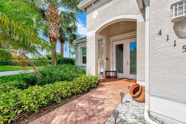 view of exterior entry featuring french doors