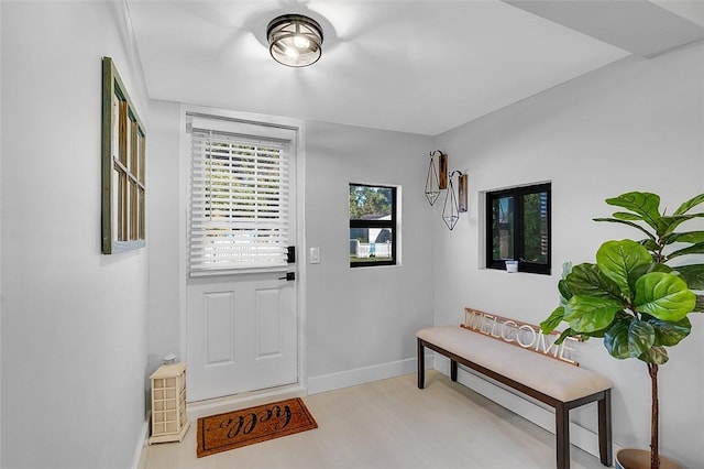 foyer entrance with light wood-type flooring