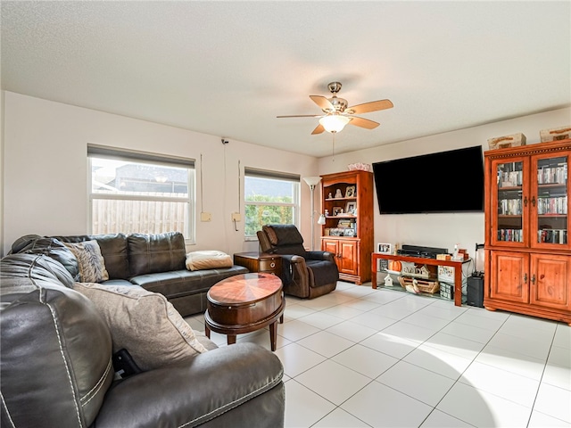 tiled living room featuring ceiling fan