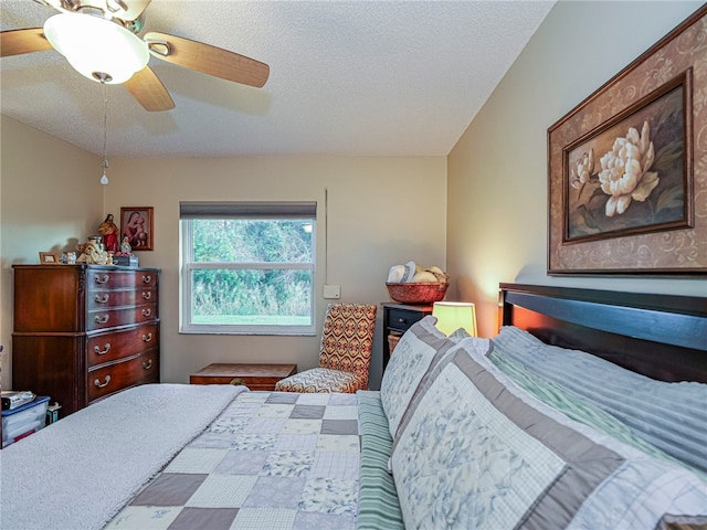 bedroom featuring a textured ceiling and ceiling fan