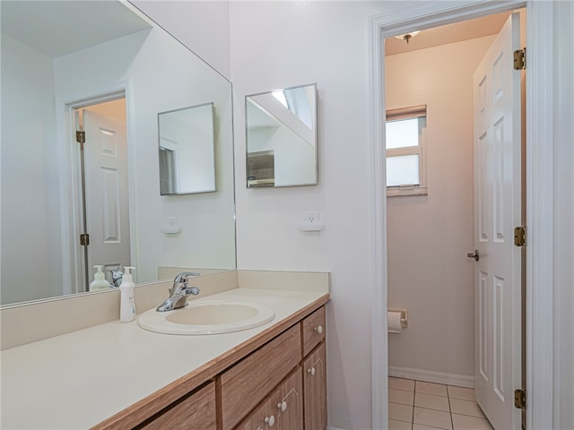 bathroom with tile patterned floors and vanity