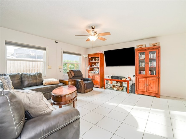 living room with ceiling fan and light tile patterned floors