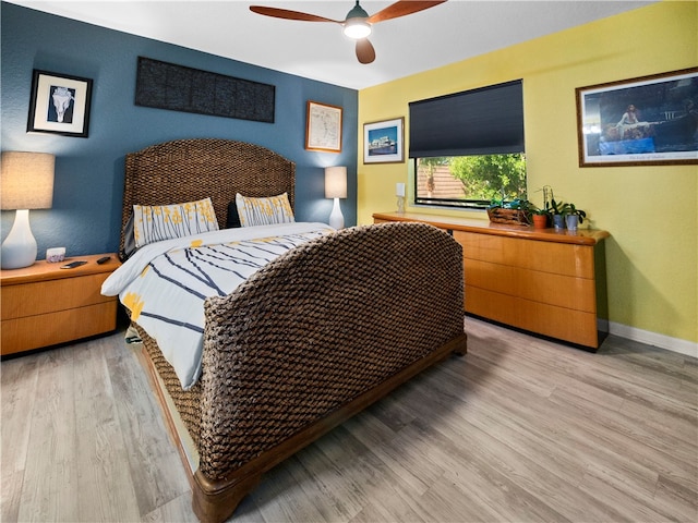 bedroom featuring ceiling fan and light hardwood / wood-style flooring