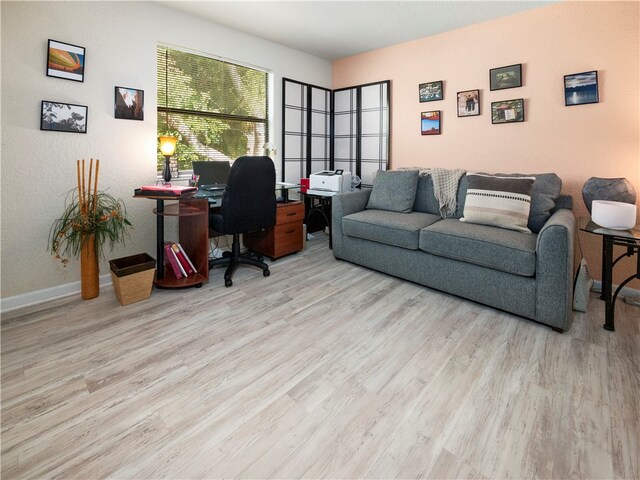 office with light wood-type flooring