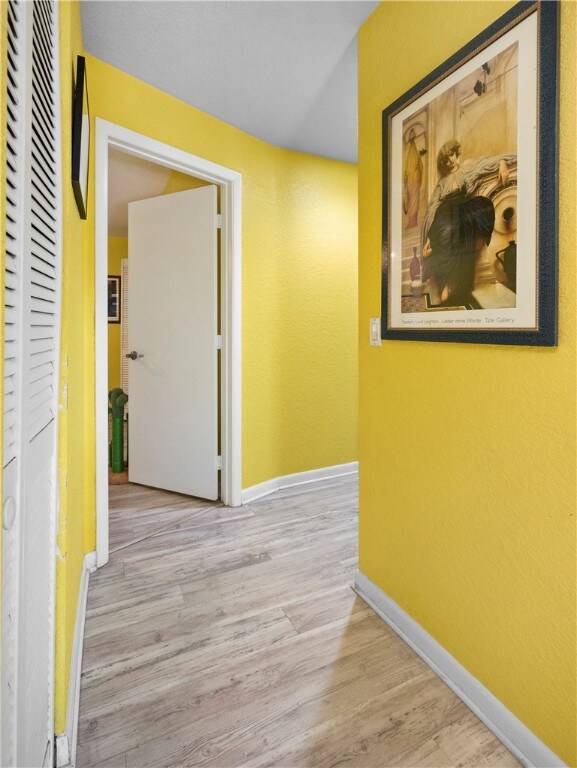 hallway featuring light wood-type flooring