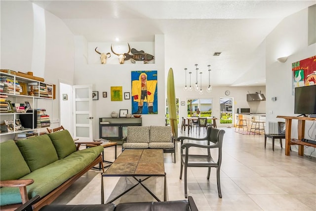 649 E Causeway Blvd, Vero Beach, FL 32963 - living room featuring high vaulted ceiling and light tile patterned floors