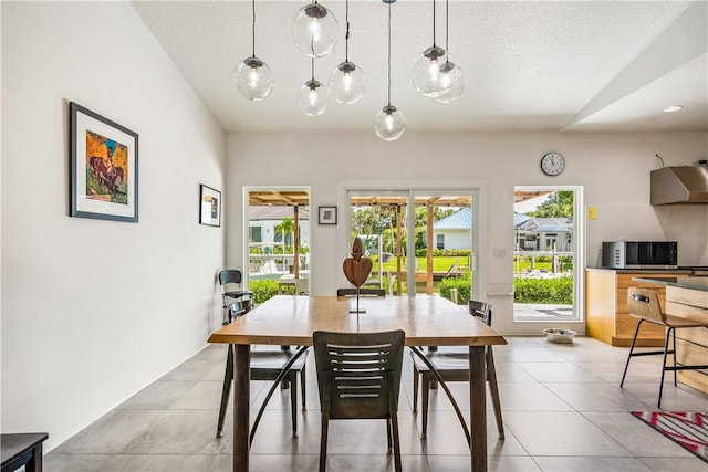 649 E Causeway Blvd, Vero Beach, FL 32963 - dining room featuring healthy amount of natural light and light tile patterned floors