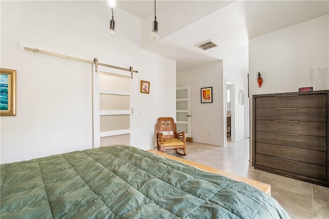 649 E Causeway Blvd, Vero Beach, FL 32963 - tiled bedroom with a barn door