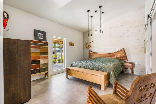 649 E Causeway Blvd, Vero Beach, FL 32963 - bedroom with vaulted ceiling, access to exterior, and tile patterned floors