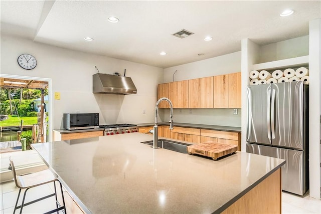 649 E Causeway Blvd, Vero Beach, FL 32963 - kitchen featuring exhaust hood, appliances with stainless steel finishes, an island with sink, recessed lighting, and modern cabinets