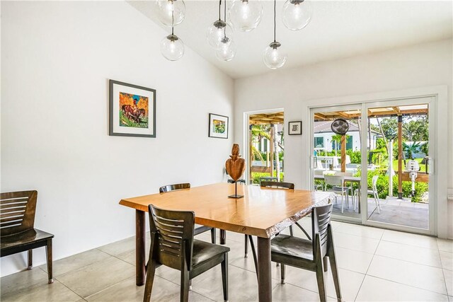 649 E Causeway Blvd, Vero Beach, FL 32963 - dining room featuring french doors and light tile patterned floors