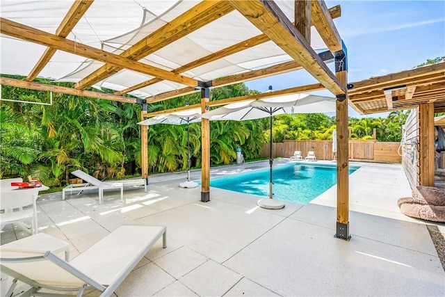 649 E Causeway Blvd, Vero Beach, FL 32963 - view of pool featuring a pergola, a patio area, and a fenced backyard