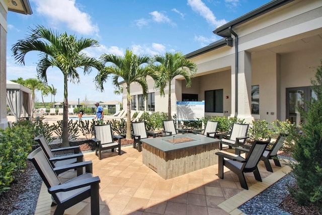 view of patio featuring an outdoor fire pit