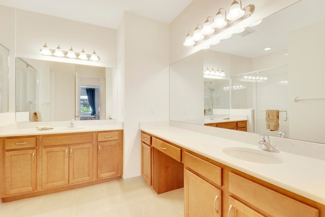 bathroom with a sink, two vanities, a stall shower, and tile patterned floors