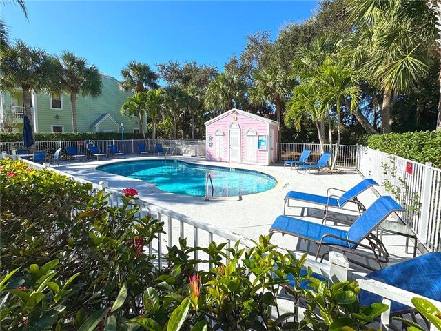 view of swimming pool featuring a patio area