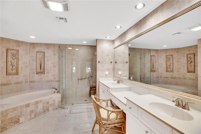 bathroom featuring vanity, shower with separate bathtub, tile walls, and tile patterned floors