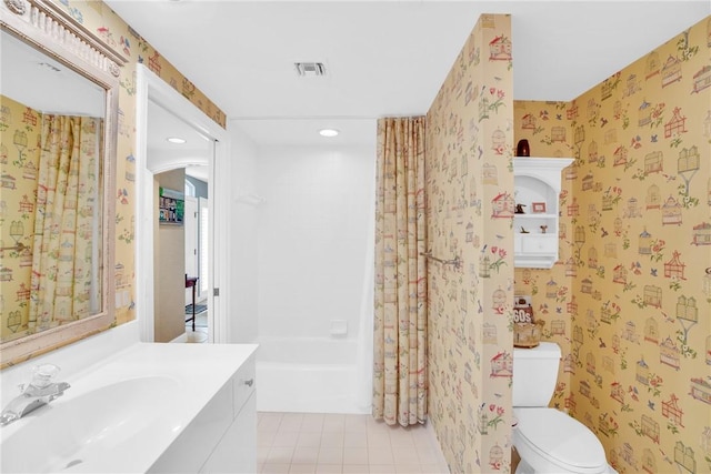 full bathroom featuring shower / bath combination, toilet, and vanity