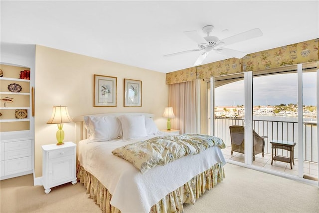 carpeted bedroom featuring ceiling fan and access to outside