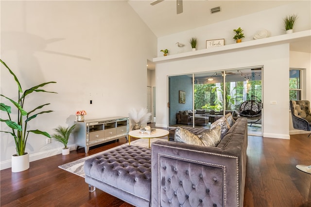 living room featuring ceiling fan, high vaulted ceiling, and dark hardwood / wood-style floors