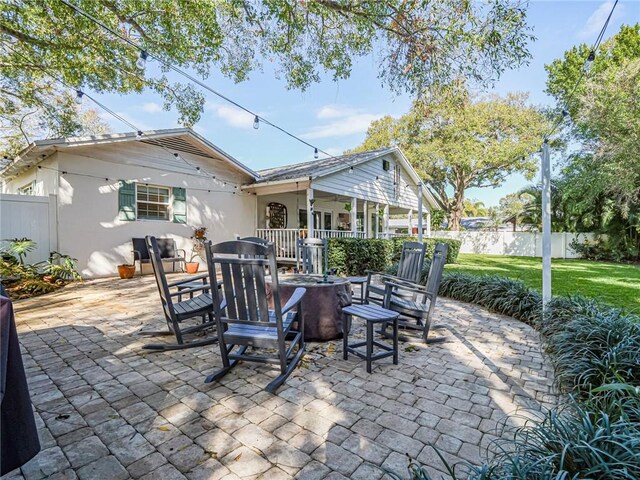 view of patio / terrace with an outdoor fire pit