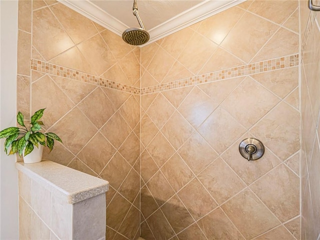 bathroom featuring a tile shower and ornamental molding