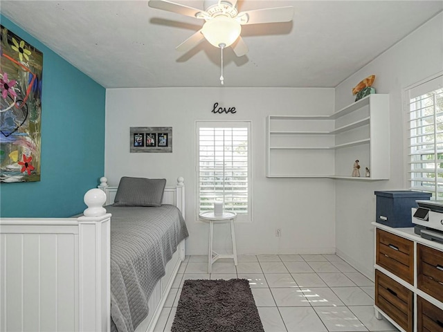 tiled bedroom with ceiling fan