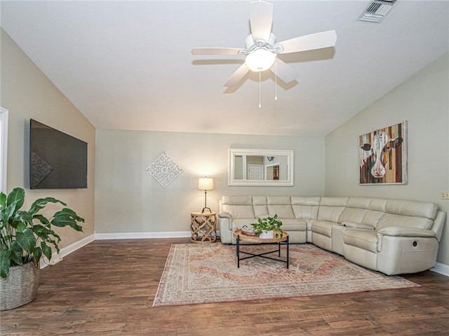 living room featuring ceiling fan, dark hardwood / wood-style flooring, and lofted ceiling