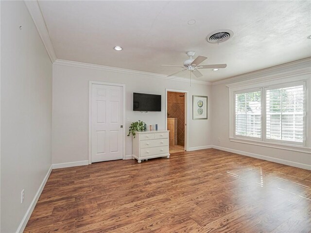 interior space featuring crown molding, hardwood / wood-style floors, and ceiling fan