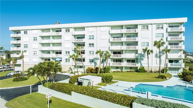 view of property featuring a community pool