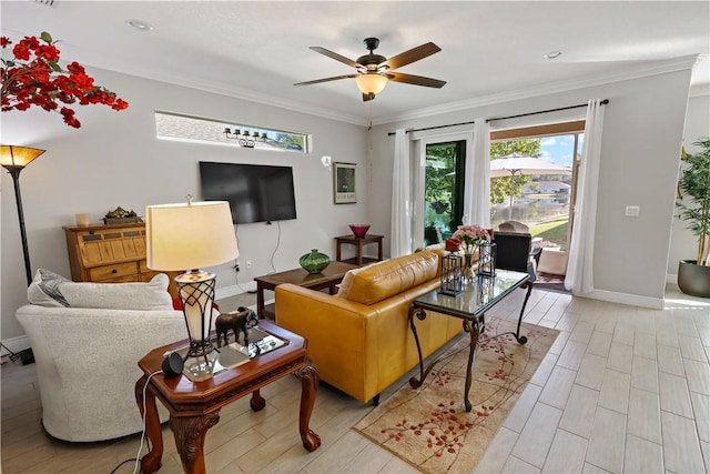 living room with ceiling fan, baseboards, light wood finished floors, and ornamental molding