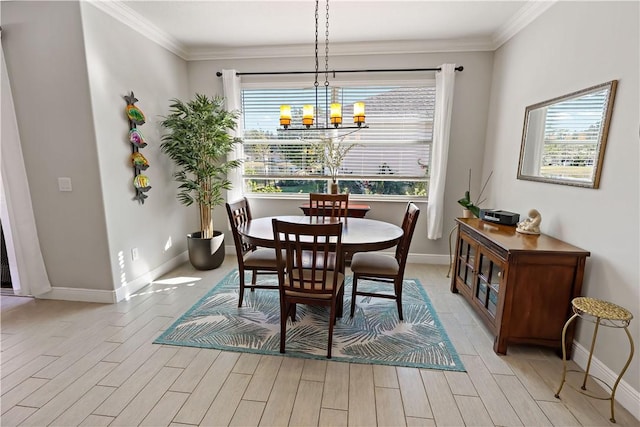 dining space featuring crown molding, light wood-style flooring, and a chandelier