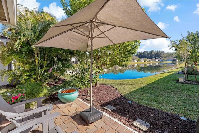 view of patio with a water view