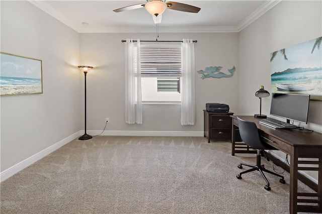 carpeted office featuring ceiling fan, baseboards, and ornamental molding