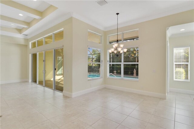 spare room featuring a high ceiling, ornamental molding, light tile patterned floors, and a notable chandelier