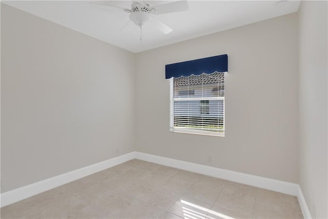 unfurnished room with light tile patterned floors and ceiling fan