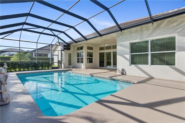 view of pool with a lanai and a patio