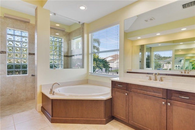 400 Sapphire Way SW, Vero Beach, FL 32968 - full bath featuring vanity, a bath, a walk in shower, tile patterned floors, and recessed lighting