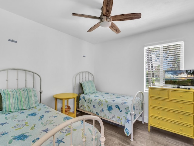 bedroom featuring ceiling fan and wood-type flooring