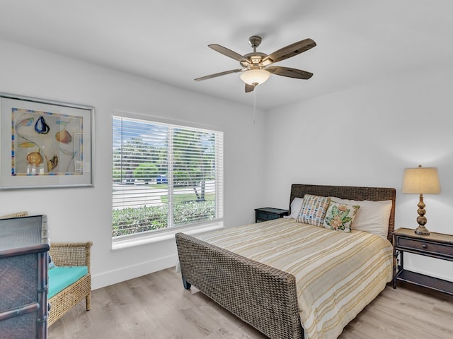 bedroom featuring ceiling fan and light hardwood / wood-style flooring