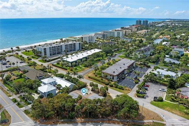 bird's eye view featuring a beach view and a water view