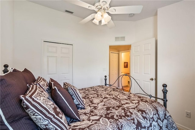 bedroom with visible vents, a closet, and ceiling fan